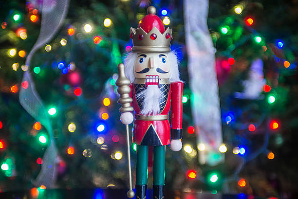 istock Soldier nutcracker statue standing in front of decorated Christm 520007502