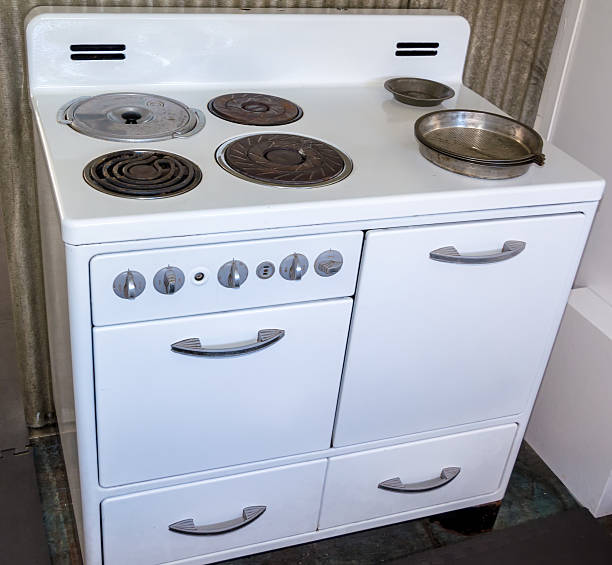 istock Antique white oven from the past with burners 520008648