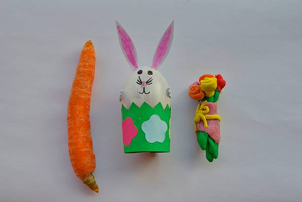 istock Children handmade: Easter bunny with flowers and carrot 520010216