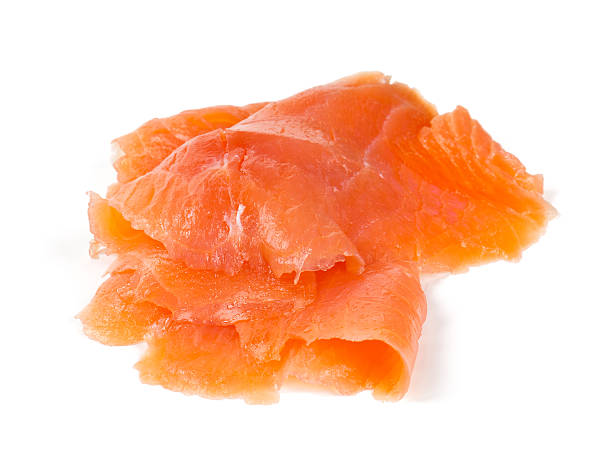 smoked salmon slices isolated on white background smoked salmon slices isolated on white background smoked salmon stock pictures, royalty-free photos & images