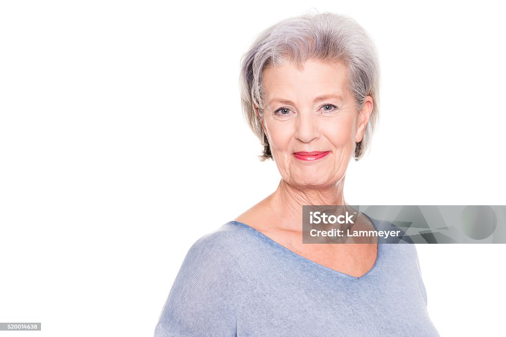 Just smiling Smiling senior woman in front of white background Senior Women Stock Photo