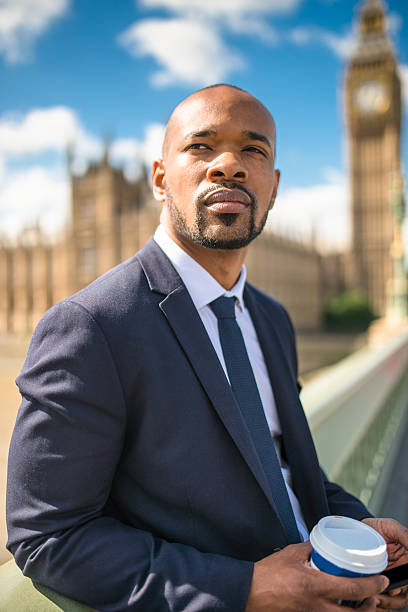 istock Businessman with coffee mug chilling in London 520014728