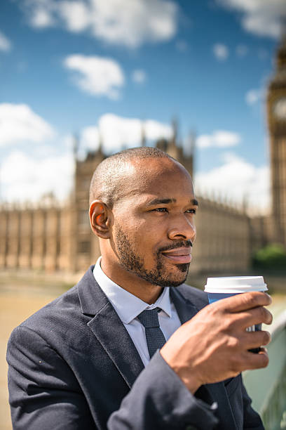istock Businessman with coffee mug chilling in London 520015028