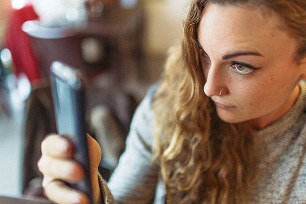 istock Young woman and her mobile phone 520015400