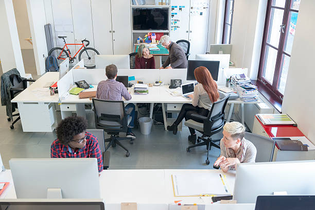 istock Modern business people in busy office 520018719