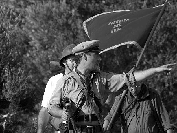 Fayon, Spain - July 26, 2014: Recreation of the battle of fayon ( Zaragoza ), passed during the Spanish civil war in 1938. In the photography they appreciate groups of soldiers, recreating the above mentioned battle.  