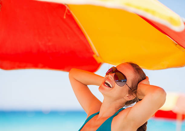 istock happy woman enjoying vacation on beach 520021045
