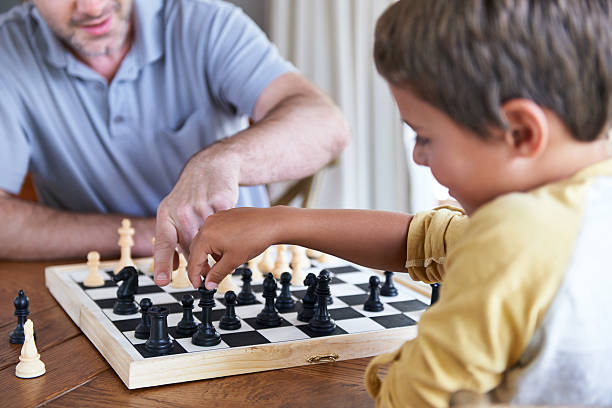 listo para checkmate? - mid adult men smart casual white happiness fotografías e imágenes de stock