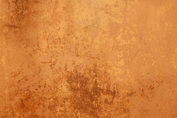 istock Texture of old wall covered with yellow stucco 520022339