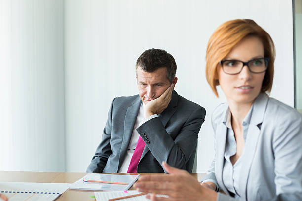 istock Bored businessman in conference meeting 520022659