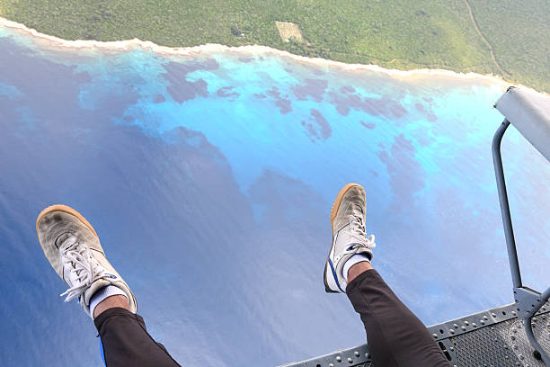 Parachutist prepares to jump from a helicopter, Altitude 3000 feet, Losinj Island,Croatia.