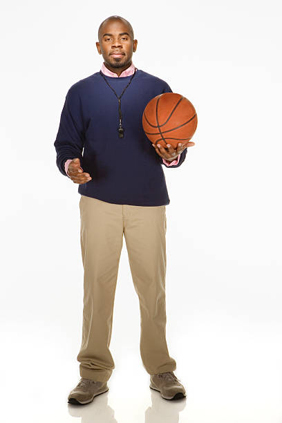 Close up man holds orange ball, Concept, sport equipment. Play basketball for exercise or play for competition. Exercise for health. Healthy lifestyle. Workout makes strong of body