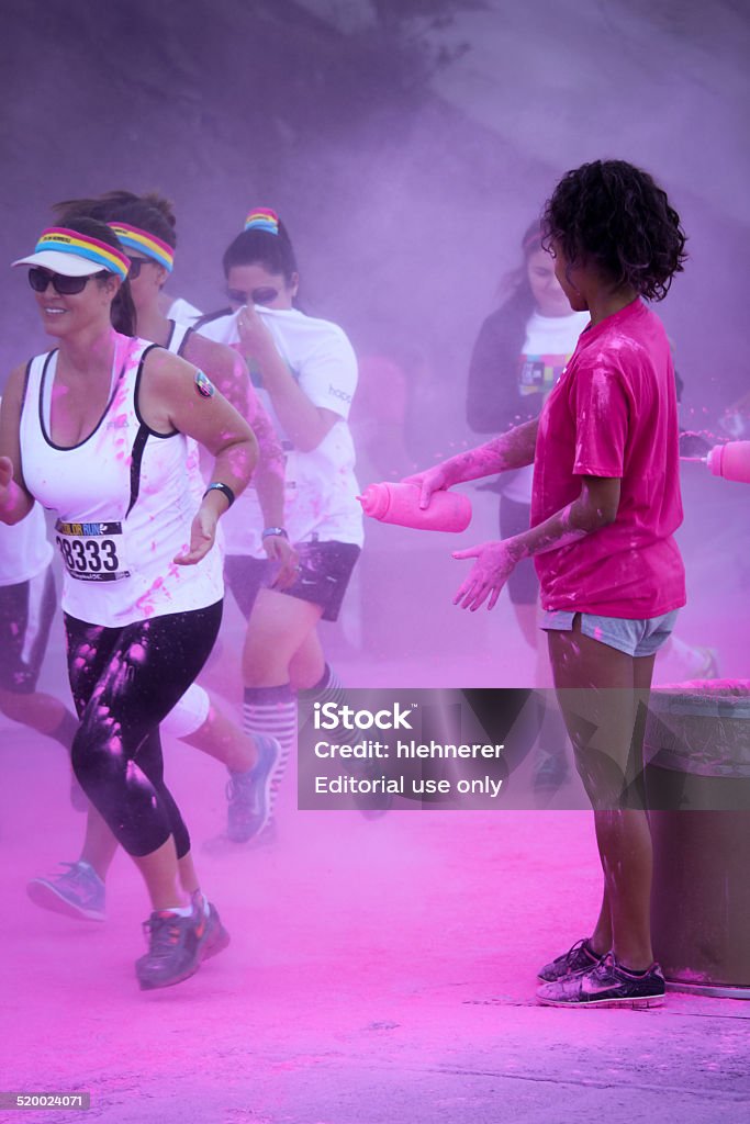 The Color Run Ventura Ventura, CA . USA - October 18, 2014: Participants coming through the pink color station at The Color Run 2014 in Ventura. OCTOBER 18, 2014 in Ventura, CA. Activity Stock Photo