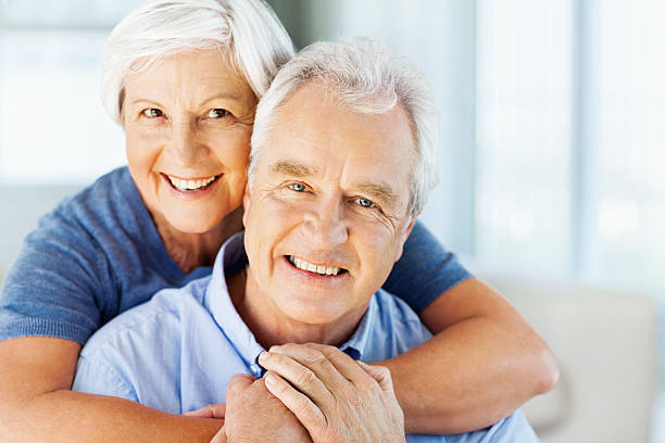 istock Happy Woman Embracing Man From Behind At Home 520024347
