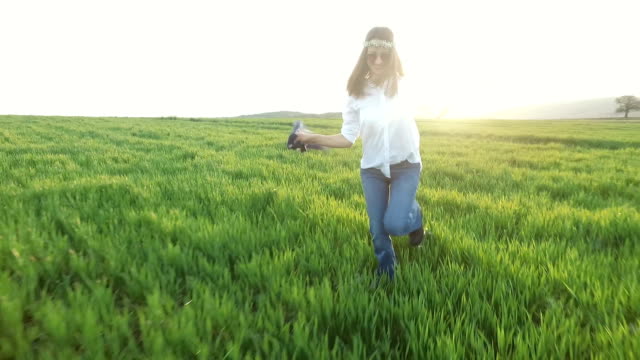 Woman in field enjoying the nature
