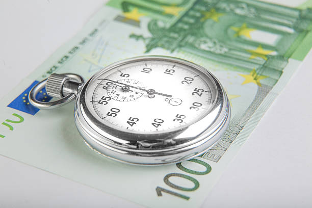 istock Stopwatch and a hundred euro banknote 520038643
