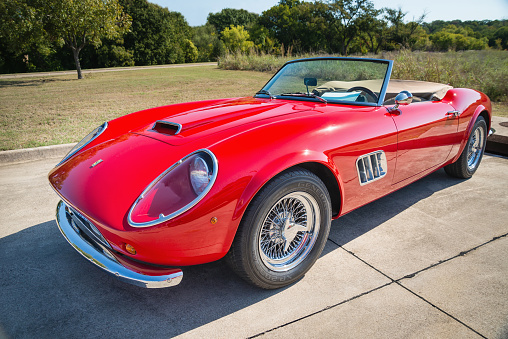 Westlake, Texas, USA - October 18, 2014: A red 1962 Ferrari 250 GT California Spyder is on display at the 4th Annual Westlake Classic Car Show. Front side view.