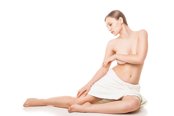 istock Young beautiful woman wrapped in towel after bath 520039167