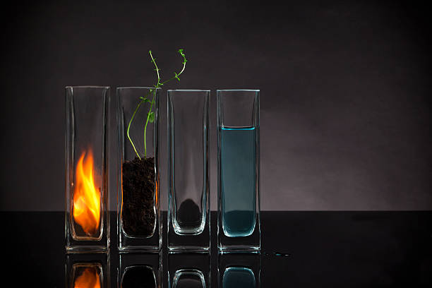 The four elements still-life The four elements - Fire, Earth, Air and Water arranged in glass vases the four elements stock pictures, royalty-free photos & images