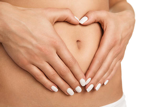 schwangerschaft und ernährung-konzept - abdomen women massaging human hand stock-fotos und bilder