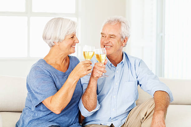 istock Senior Couple Toasting Wineglasses While Looking At Each Other 520042153