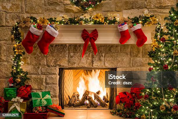 Christmas Fireplace Tree Stockings Fire Hearth Lights And Decorations Stock Photo - Download Image Now