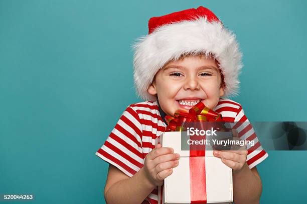 Kid With Christmas Gift Stock Photo - Download Image Now - Child, Christmas, Christmas Present