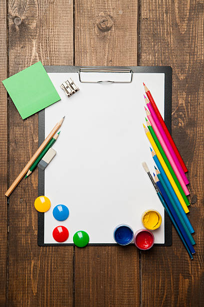 istock School supplies with blank on wooden background 520044759
