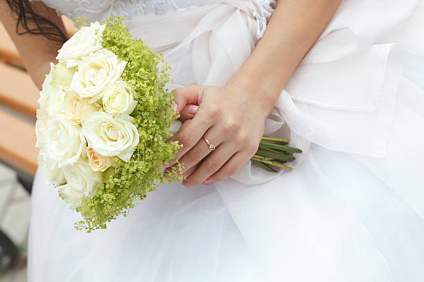 istock Wedding bunch of flowers in hands  the bride 520045083