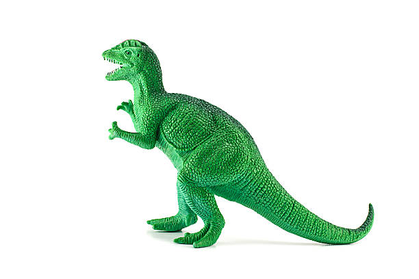 istock Green Dilophosaurus dinosaur toy figure isolated on white. 520045193