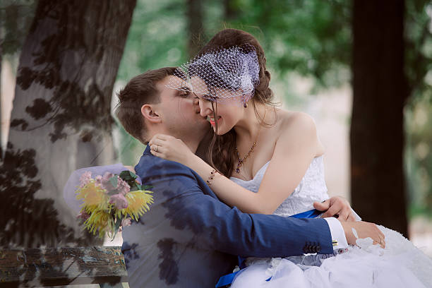 istock the newly married couple standing at park 520047056