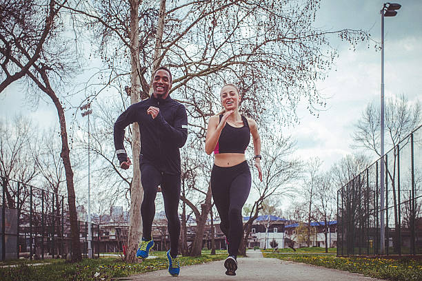 istock Couple jogging together in the park 520049414