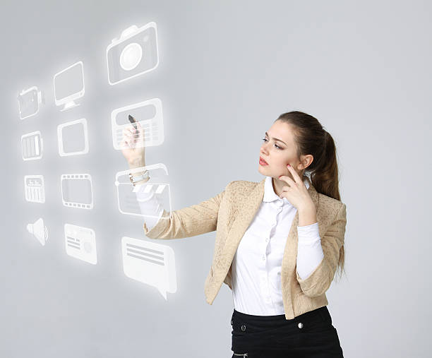 istock Woman pressing high tech type of modern multimedia buttons on 520050272