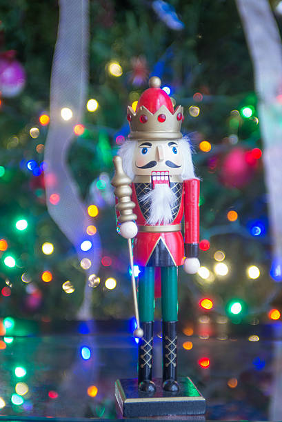 istock Soldier nutcracker statue standing in front of decorated Christm 520050704