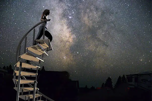 Photo of woman climbing to the stars