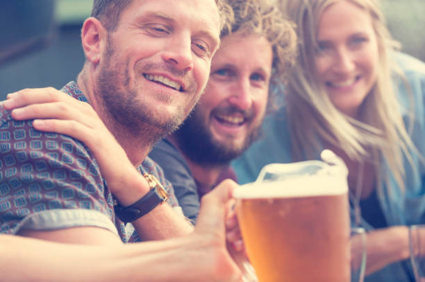 istock Group of friends drinking beer and having fun. 520052994
