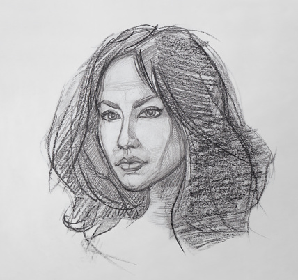 The Fine Art Portrait of the Young Woman. Female Face. Human Head. Sketch. Hand Drawing. It is a Pencil Drawing.