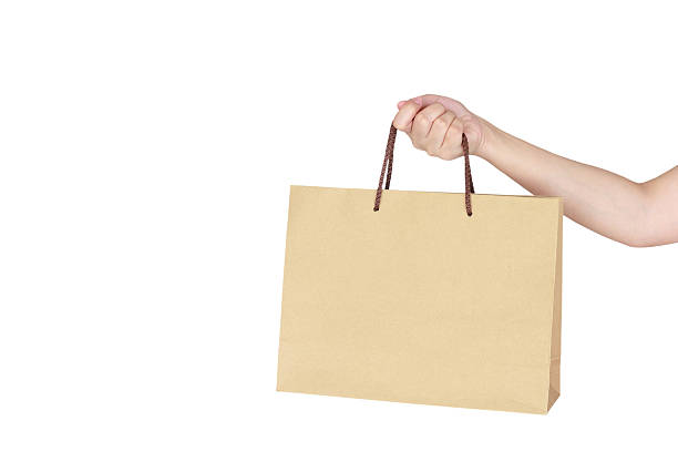 istock Female hand holding shopping bag 520056446
