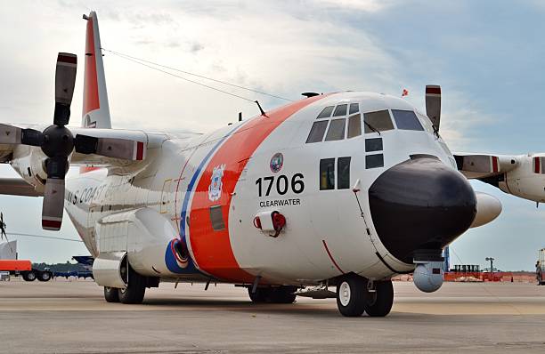 Tampa, USA - March 18, 2016: A U.S. Coast Guard C-130H surveillance plane parked on the runway at MacDill Air Force Base in Florida. This C-130H Hercules is assigned to the Coast Guard's Clearwater Air Station.