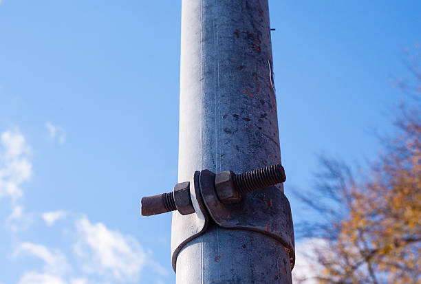 istock Dirty metal pole with rusted fastener. 520057262