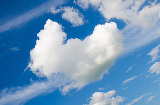 istock blue heart sky and clouds ,Green Field 520072111