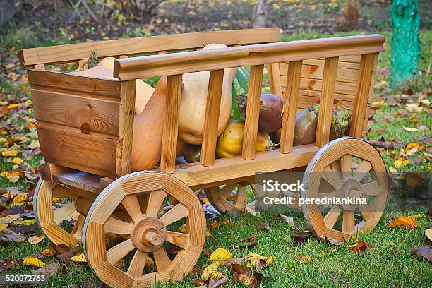 Harvest Pumpkins In A Wooden Cart Stock Photo - Download Image Now - Autumn, Bush, Carriage