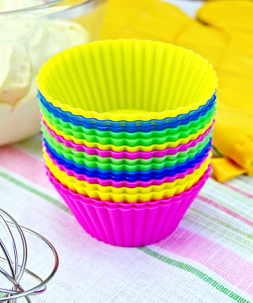 istock Molds for cupcakes with potholder and dough on tissue 520074715
