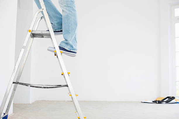 istock Low section of man on ladder 520075447