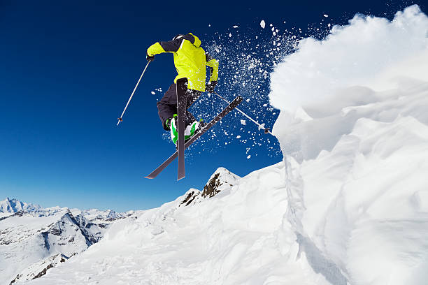 istock Alpine skier on piste, skiing downhill 520075729
