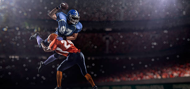 American football players American football players are playing on the big arena football player stock pictures, royalty-free photos & images