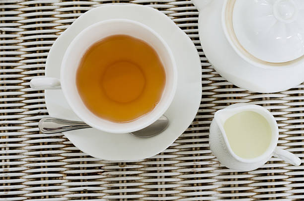 istock Cup of tea with little milk jar and teapot 520077793