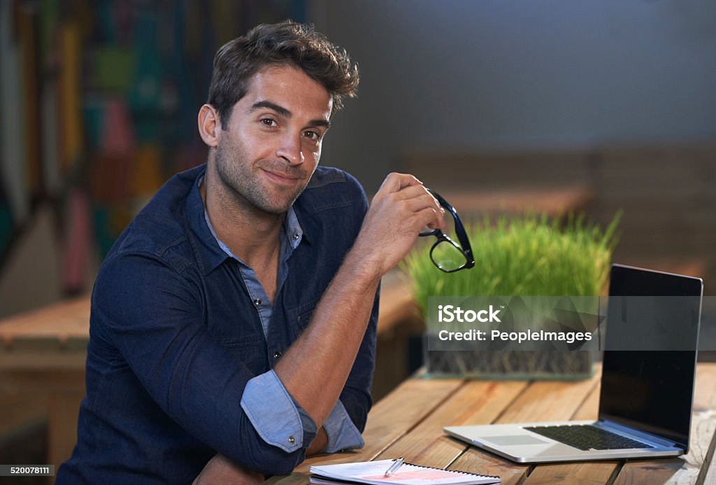 He's up for any challenge Portrait of a young male entrepreneur sitting at his work desk 30-39 Years Stock Photo