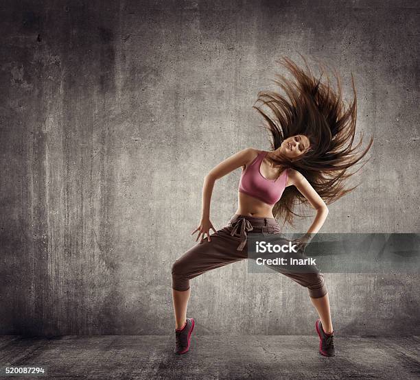 Fitness Sport Dance Woman Dancer Flying Hair Dancing On Concrete Stock Photo - Download Image Now