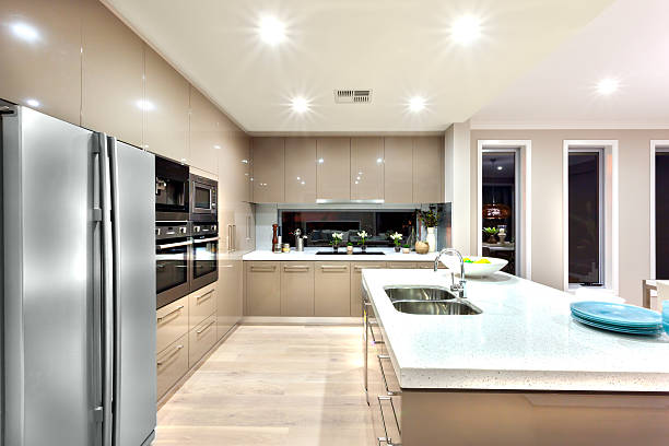 istock Modern well lit kitchen with stylish new refrigerator 520087488